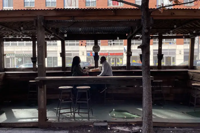 An outdoor dining shed at the Double Dutch Espresso café in Harlem. A City Council bill is proposing new regulations on outdoor dining structures, including fees and seasons of operation.